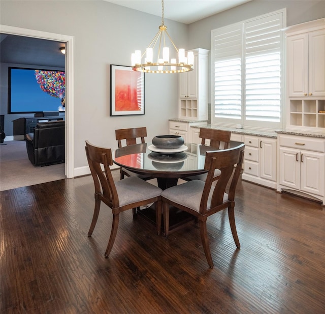 13896 Evergreen Dr, Frisco, TX 75035 - dining area with a chandelier and dark wood-type flooring
