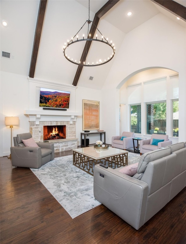 13896 Evergreen Dr, Frisco, TX 75035 - living area with high vaulted ceiling, wood finished floors, beamed ceiling, a chandelier, and a stone fireplace