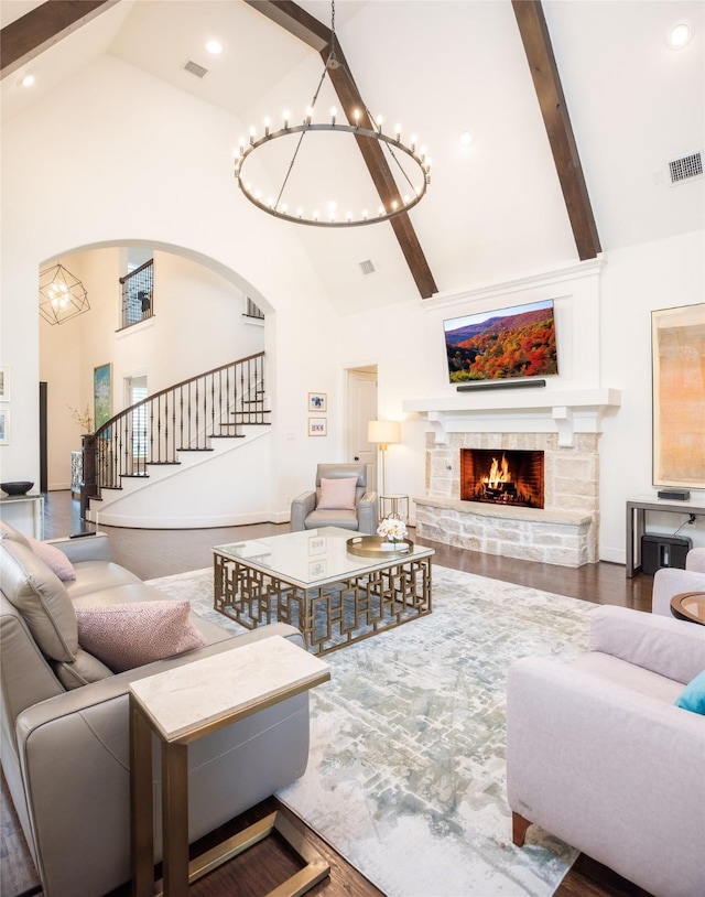 13896 Evergreen Dr, Frisco, TX 75035 - living room with a chandelier, high vaulted ceiling, stairway, a fireplace, and beam ceiling