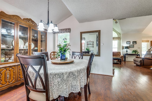 1405 Mapleton Ct, Arlington, TX 76018 - dining space featuring a textured ceiling, vaulted ceiling, a chandelier, and dark wood-type flooring