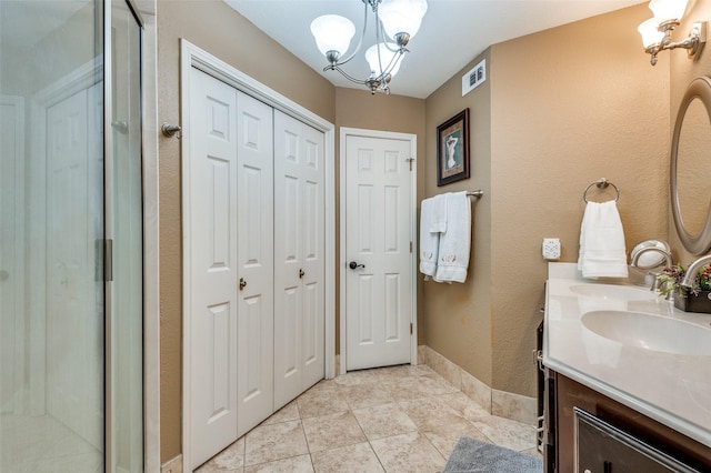 1405 Mapleton Ct, Arlington, TX 76018 - bathroom with a closet, a chandelier, double vanity, and a shower stall