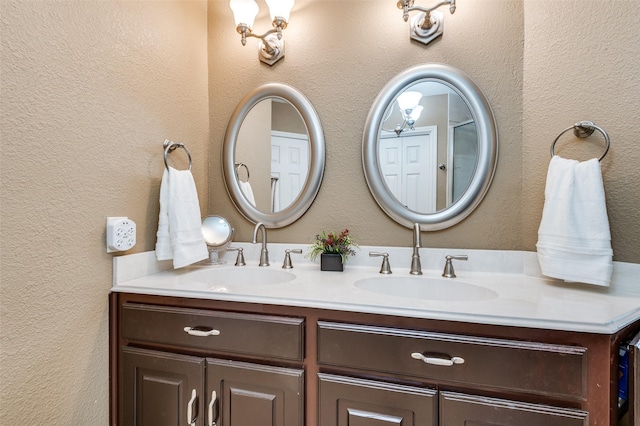 1405 Mapleton Ct, Arlington, TX 76018 - bathroom featuring double vanity and a textured wall