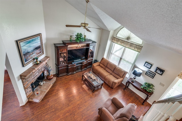 1405 Mapleton Ct, Arlington, TX 76018 - living room featuring a fireplace, lofted ceiling, ceiling fan, wood finished floors, and a textured ceiling