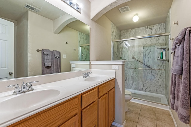 1138 Sophia St, Allen, TX 75013 - bathroom featuring a marble finish shower, double vanity, and tile patterned flooring