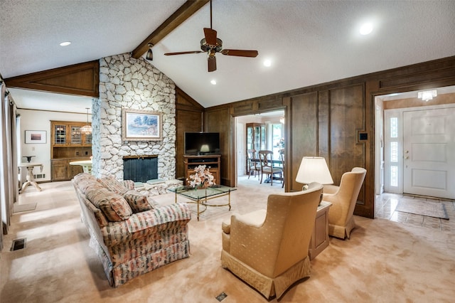 8220 Coolgreene Dr, Dallas, TX 75228 - living room featuring ceiling fan, light colored carpet, wooden walls, a stone fireplace, and a textured ceiling