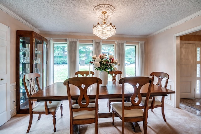 8220 Coolgreene Dr, Dallas, TX 75228 - dining space with a textured ceiling, a chandelier, a decorative wall, ornamental molding, and light colored carpet