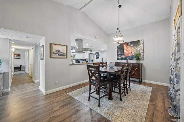 864 Warwick Dr, Plano, TX 75023 - dining area featuring a chandelier, wood finished floors, and high vaulted ceiling