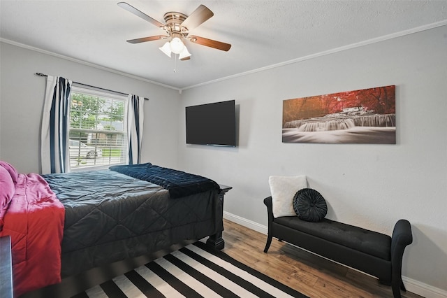 864 Warwick Dr, Plano, TX 75023 - bedroom with crown molding, wood finished floors, and ceiling fan