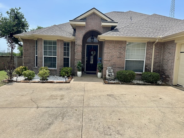 6436 Meadowcrest Ln, Sachse, TX 75048 - view of front of home with brick siding and roof with shingles