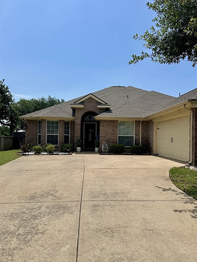 6436 Meadowcrest Ln, Sachse, TX 75048 - single story home featuring brick siding, concrete driveway, a shingled roof, and a garage