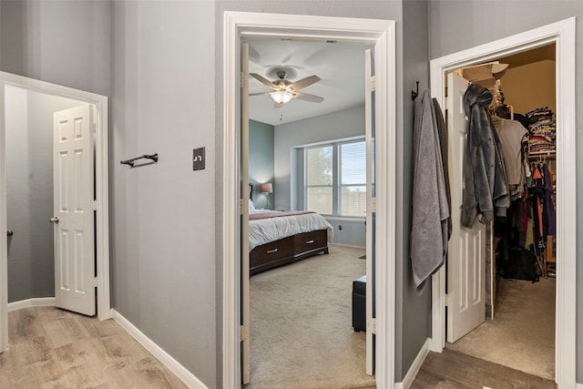 6436 Meadowcrest Ln, Sachse, TX 75048 - bedroom featuring a walk in closet, light wood-style flooring, and a closet