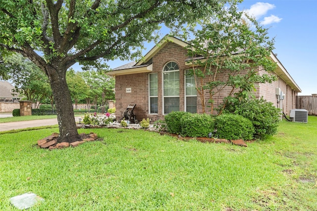 6436 Meadowcrest Ln, Sachse, TX 75048 - view of property exterior featuring brick siding and a central AC unit