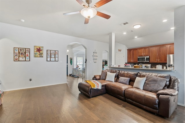 6436 Meadowcrest Ln, Sachse, TX 75048 - living room with arched walkways, ceiling fan, vaulted ceiling, wood finished floors, and recessed lighting