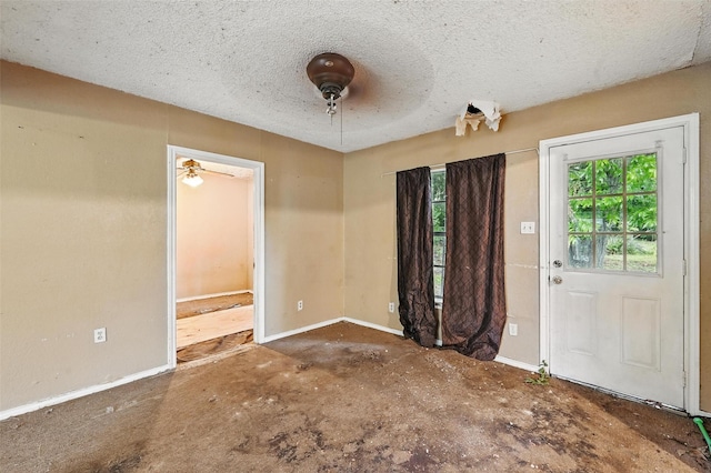 3824 Stuart Dr, Fort Worth, TX 76110 - foyer with baseboards and a textured ceiling