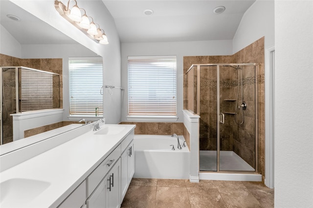5608 Grove Cove Dr, Mckinney, TX 75071 - full bathroom with double vanity, a garden tub, a stall shower, plenty of natural light, and vaulted ceiling