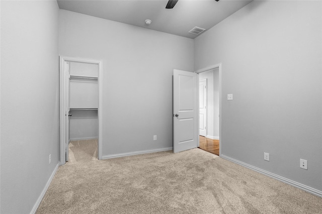 5608 Grove Cove Dr, Mckinney, TX 75071 - unfurnished bedroom featuring carpet floors, a walk in closet, a ceiling fan, and a closet