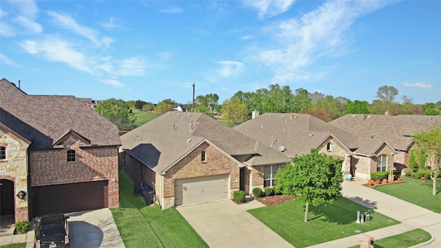 5608 Grove Cove Dr, Mckinney, TX 75071 - french country inspired facade with brick siding, driveway, a front lawn, and a residential view