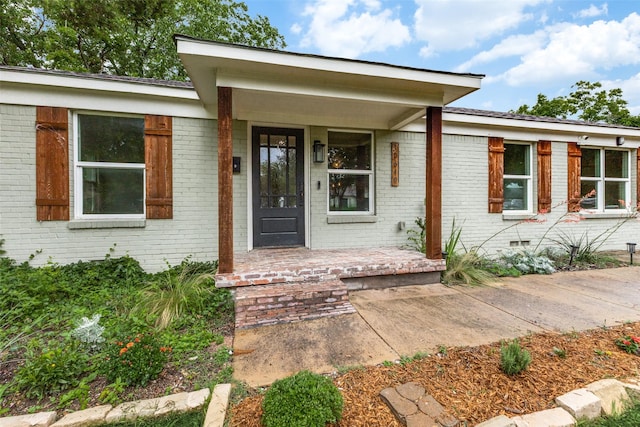 10649 Sylvia Dr, Dallas, TX 75228 - property entrance with covered porch and brick siding