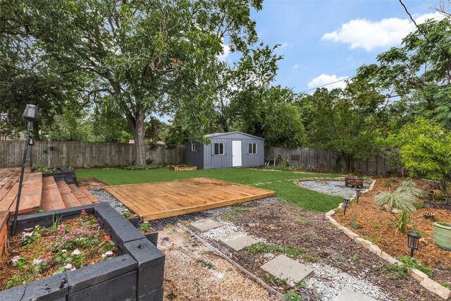 10649 Sylvia Dr, Dallas, TX 75228 - fenced backyard featuring a deck, an outdoor structure, and a fire pit
