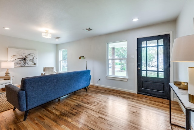10649 Sylvia Dr, Dallas, TX 75228 - living area with wood finished floors, healthy amount of natural light, and recessed lighting