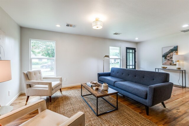 10649 Sylvia Dr, Dallas, TX 75228 - living room featuring light wood-style floors and recessed lighting
