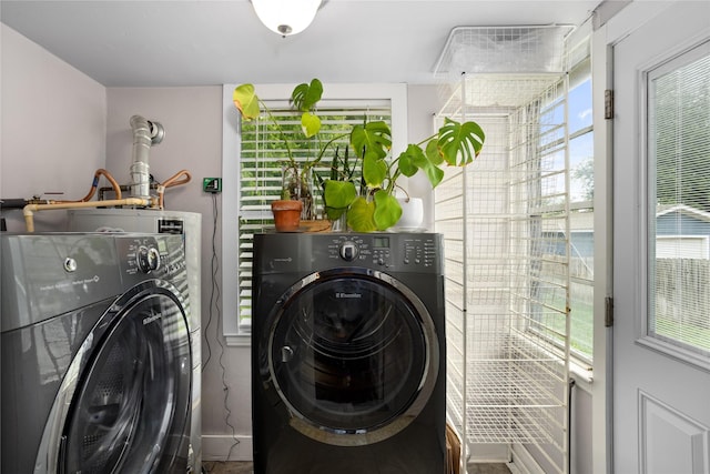 1617 Virginia Pl, Fort Worth, TX 76107 - washroom featuring washing machine and dryer and plenty of natural light