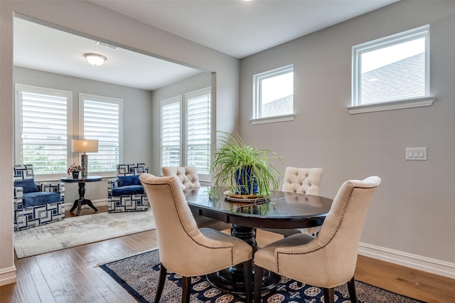 2129 Harbor Pointe Dr, Frisco, TX 75036 - dining room featuring baseboards and wood finished floors