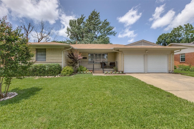 2521 Ridgecrest Dr, Garland, TX 75041 - ranch-style home with brick siding, an attached garage, concrete driveway, and a front lawn
