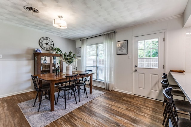 2521 Ridgecrest Dr, Garland, TX 75041 - dining area with healthy amount of natural light and dark wood finished floors