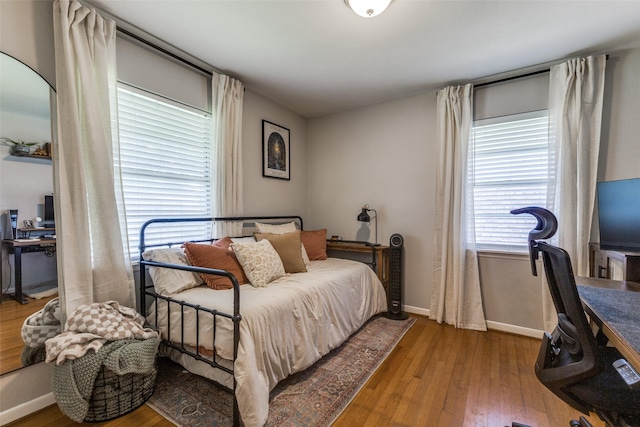 2521 Ridgecrest Dr, Garland, TX 75041 - bedroom featuring wood-type flooring and a desk