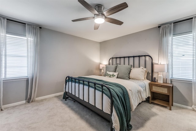 2521 Ridgecrest Dr, Garland, TX 75041 - bedroom with light colored carpet, multiple windows, and a ceiling fan
