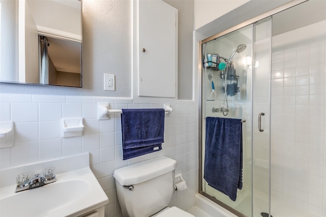 2521 Ridgecrest Dr, Garland, TX 75041 - full bath with a shower stall, vanity, tile walls, and wainscoting