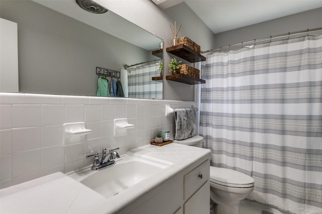 2521 Ridgecrest Dr, Garland, TX 75041 - bathroom with vanity, tile walls, tasteful backsplash, and a shower with shower curtain