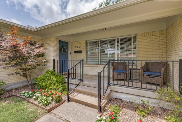 2521 Ridgecrest Dr, Garland, TX 75041 - view of exterior entry with brick siding and covered porch