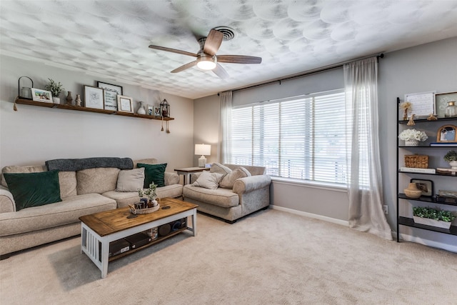 2521 Ridgecrest Dr, Garland, TX 75041 - carpeted living room featuring a ceiling fan and baseboards