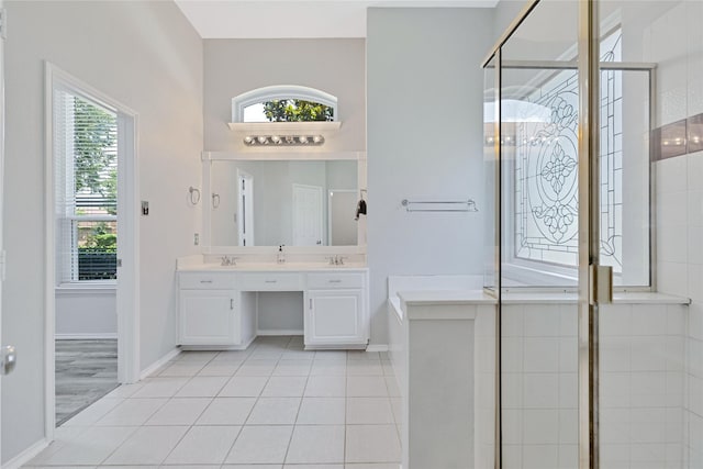 7165 Lazy Meadow Ln, Frisco, TX 75033 - bathroom with double vanity, a stall shower, and tile patterned flooring
