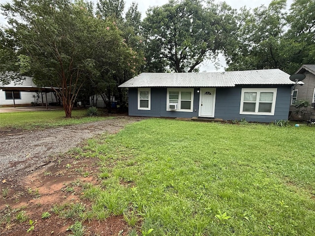 2110 W Bond St, Denison, TX 75020 - view of front of property with a front lawn and a metal roof