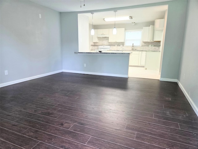 2110 W Bond St, Denison, TX 75020 - unfurnished living room with dark wood-type flooring