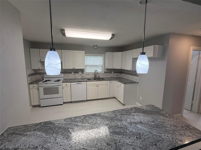 2110 W Bond St, Denison, TX 75020 - kitchen with white appliances, backsplash, light tile patterned floors, and white cabinetry