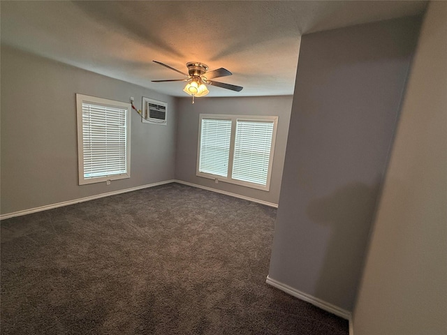 2110 W Bond St, Denison, TX 75020 - empty room featuring a wall mounted AC, ceiling fan, and dark carpet
