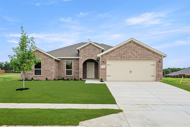 733 Stone Eagle Dr, Azle, TX 76020 - view of front of house featuring brick siding, an attached garage, concrete driveway, a front yard, and a shingled roof