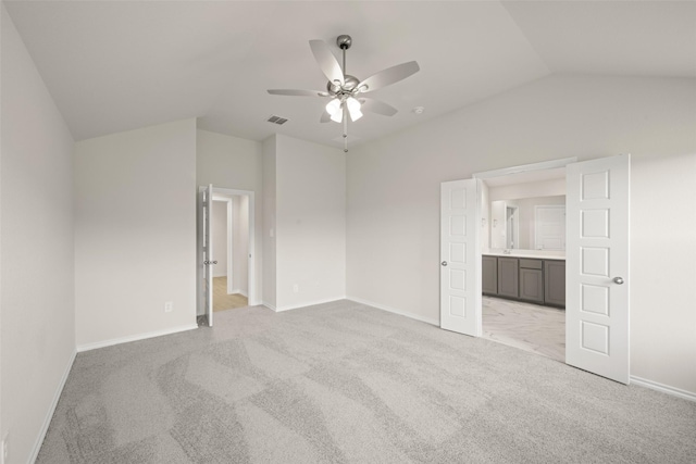 733 Stone Eagle Dr, Azle, TX 76020 - unfurnished bedroom featuring lofted ceiling, light colored carpet, ensuite bath, and ceiling fan