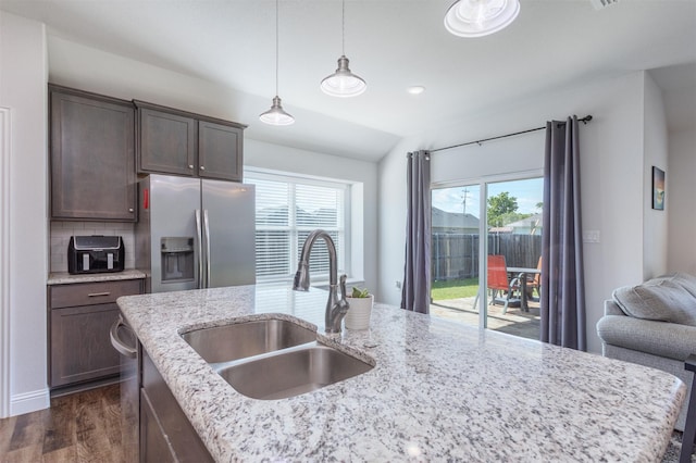111 Arrowhead Dr, Sanger, TX 76266 - kitchen featuring stainless steel refrigerator with ice dispenser, dark wood-style floors, healthy amount of natural light, decorative light fixtures, and vaulted ceiling