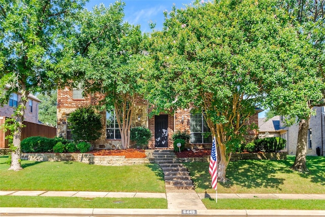 6449 Ryeworth Dr, Frisco, TX 75035 - view of property hidden behind natural elements with a front yard, stone siding, and brick siding