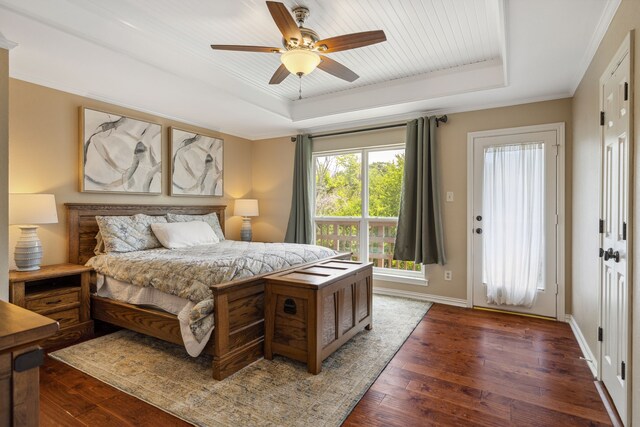 3217 Oak Tree Ln, Grapevine, TX 76051 - bedroom with a raised ceiling, dark wood finished floors, ceiling fan, and crown molding
