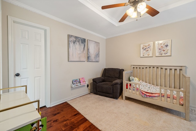 3217 Oak Tree Ln, Grapevine, TX 76051 - bedroom with wood finished floors, ornamental molding, a crib, and a ceiling fan