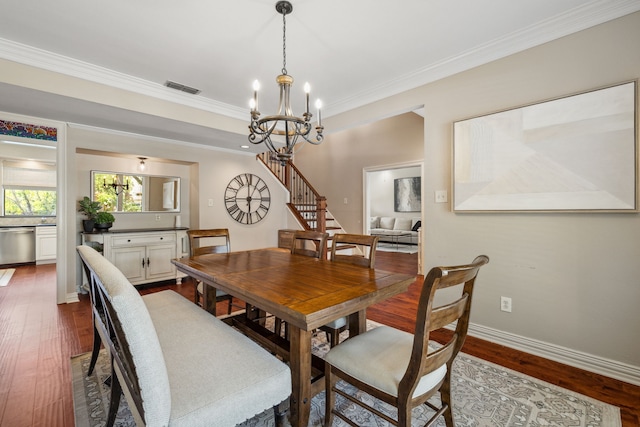 3217 Oak Tree Ln, Grapevine, TX 76051 - dining room with a chandelier, stairway, dark wood-style flooring, and ornamental molding