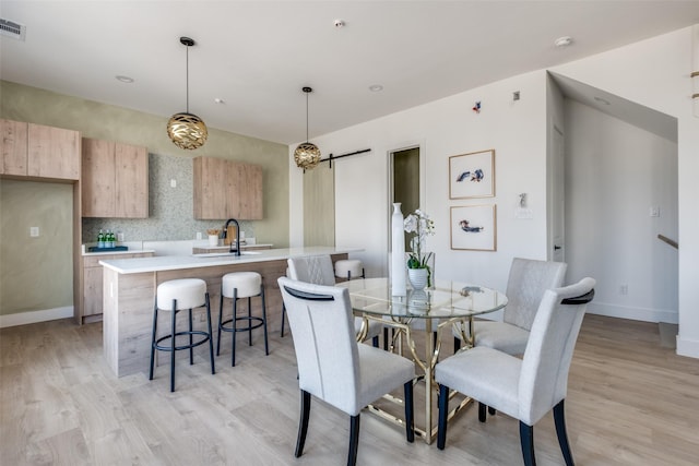 2015 N Prairie Ave Unit 104, Dallas, TX 75204 - dining space with light wood-type flooring