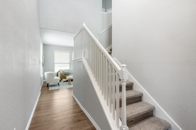 2166 Stonebrook Ln, Mesquite, TX 75181 - staircase with a textured wall and wood finished floors