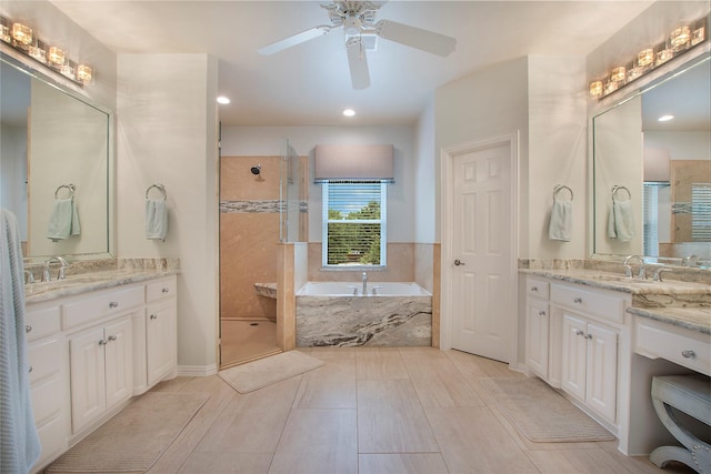 2327 Clearspring Dr N, Irving, TX 75063 - full bathroom with a stall shower, a bath, two vanities, a ceiling fan, and recessed lighting